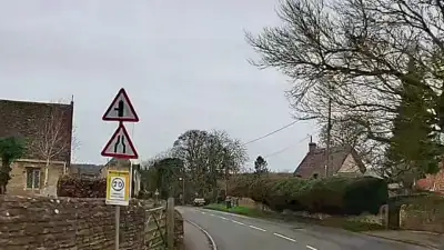 Oncoming Traffic in Narrow Village thumbnail