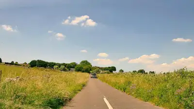 Cyclist and Narrow Road Oncoming Car thumbnail