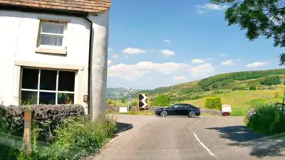 Car Emerging on Blind Bend thumbnail