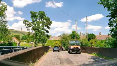 Farm Vehicle on Narrow Bridge thumbnail
