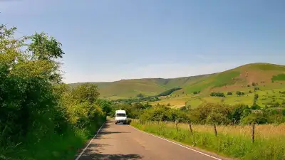 Van on Narrow Rural Bend thumbnail