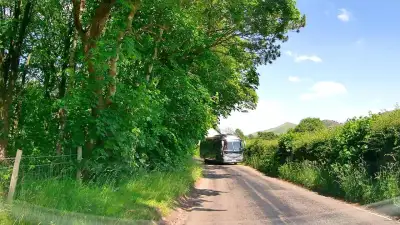 Oncoming Bus on Narrow Road thumbnail